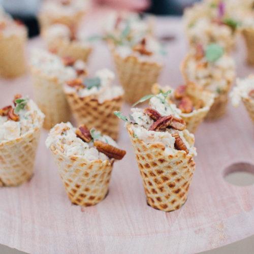 Chicken salad appetizers served in a waffle cone
