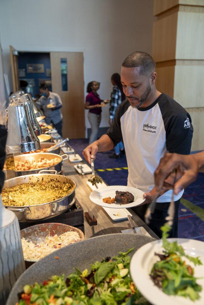 GICC employee serving food