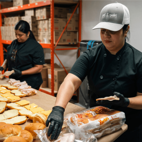 POP staff crafting sandwiches for emergency services