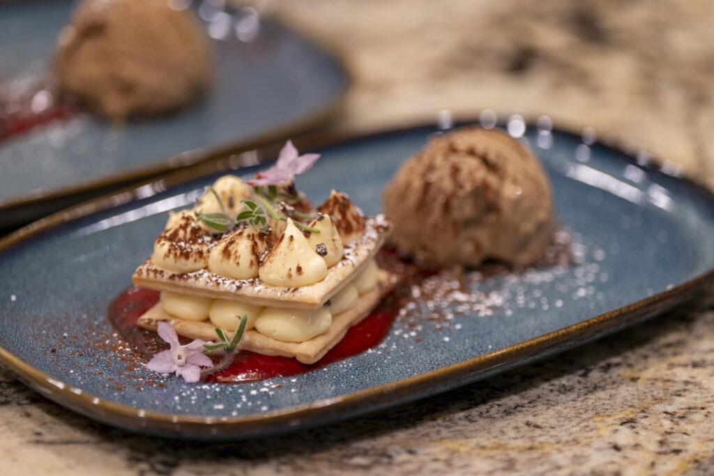 Mille-Feuille with espresso ice cream, cocoa sugar, and raspberry coulis.